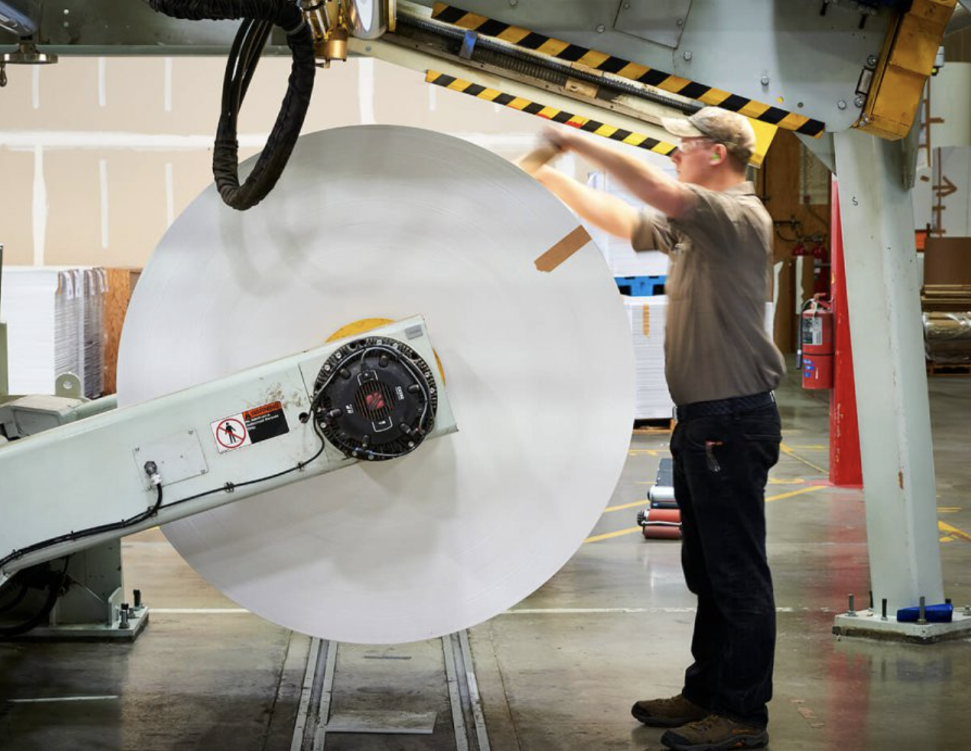 PSW worker unloading paper